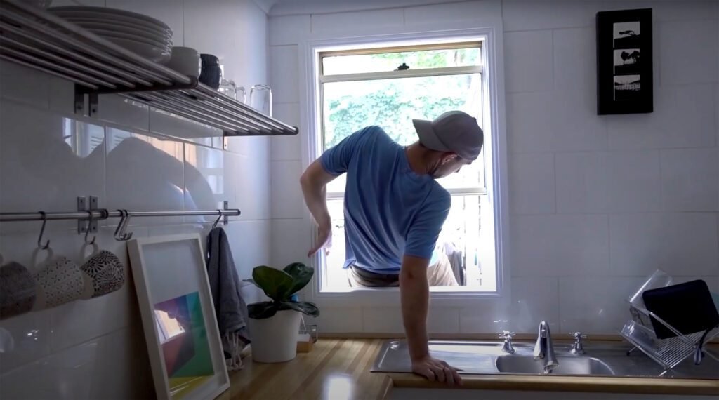 peter crawling out of our friends window in sydney australia